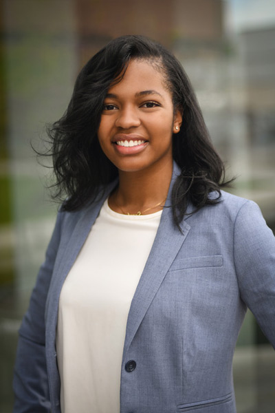 A three-quarter portrait of a young undergraduate smiling